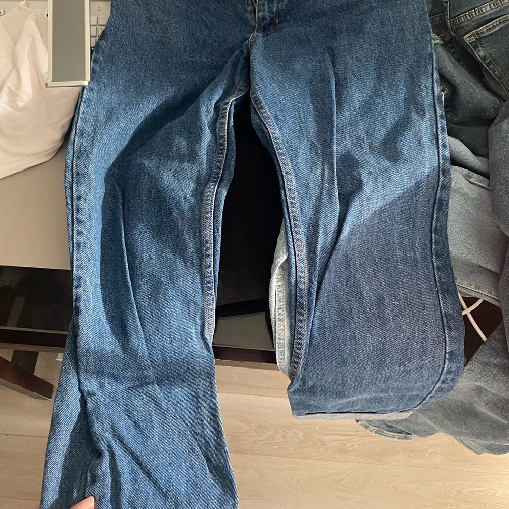 Boot cut blue jeans.